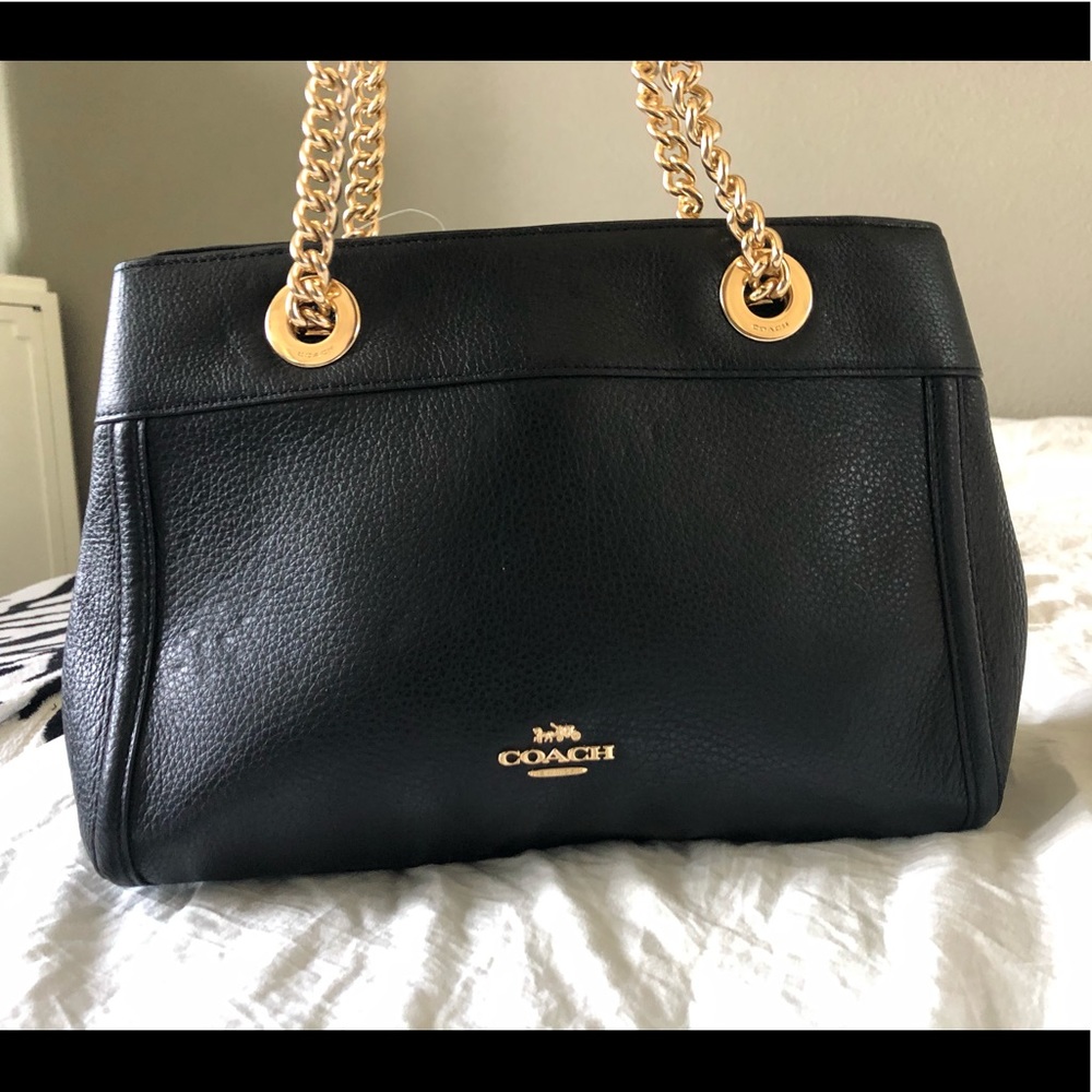 Brand new Authentic black leather coach bag.